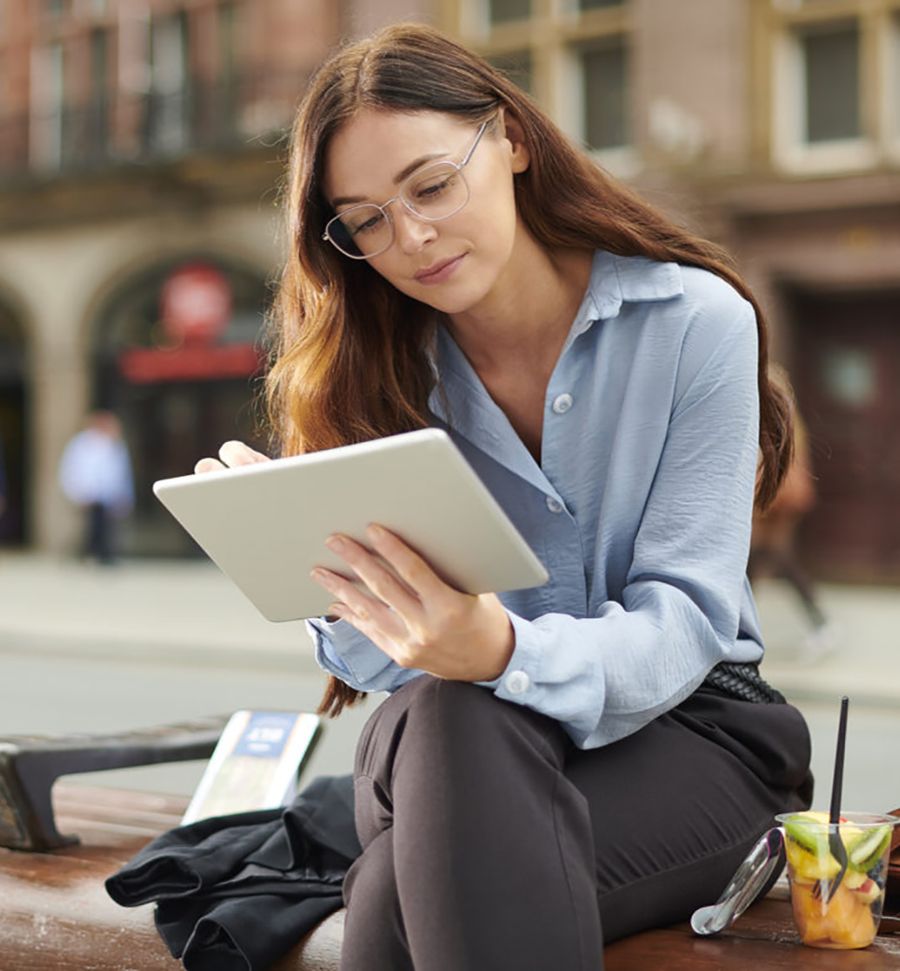 Resident reading on a terrace